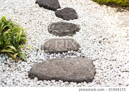 Japanese-style garden with stepping stones 81908155