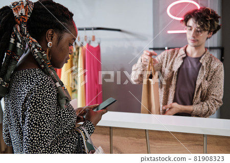 Woman paying online for her purchases Woman paying online for her purchases 81908323