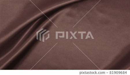 Smooth elegant brown silk or satin luxury cloth texture as abstract background. Luxurious background design wallpaper. In Sepia toned. Retro style 81909684