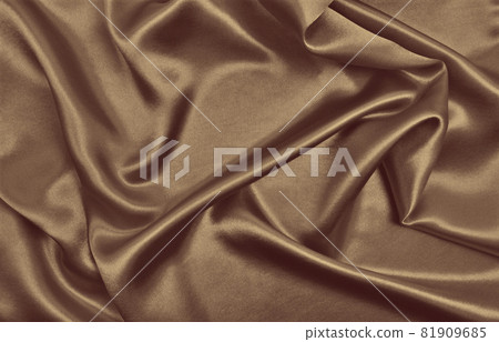 Smooth elegant brown silk or satin luxury cloth texture as abstract background. Luxurious background design wallpaper. In Sepia toned. Retro style 81909685