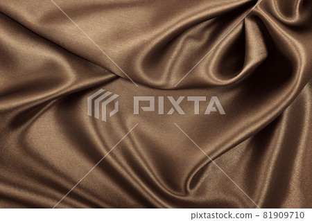 Smooth elegant brown silk or satin texture as abstract background. Luxurious background design. In Sepia toned. Retro style 81909710