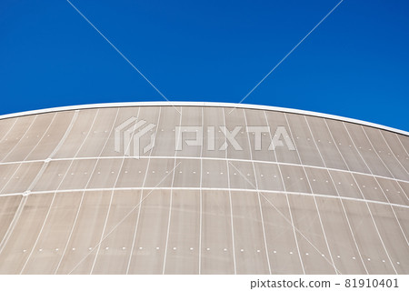 Modern building detail against blue sky. Abstract architecture background Modern building detail against blue sky. Abstract architecture background 81910401