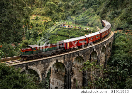 Red classic train on Nine arch bridge in Ella, Sri Lanka Red classic train on Nine arch bridge in Ella, Sri Lanka 81911923
