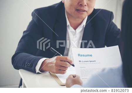 Businessman job interview by human resource HR officer interviwing, talk new employee shaking hands in office with smiling face. HR Manager interview check resume, face to face. Job Interview Concept Businessman job interview by human resource HR officer interviwing, talk new employee shaking hands in office with smiling face. HR Manager interview check resume, face to face. Job Interview Concept 81912073