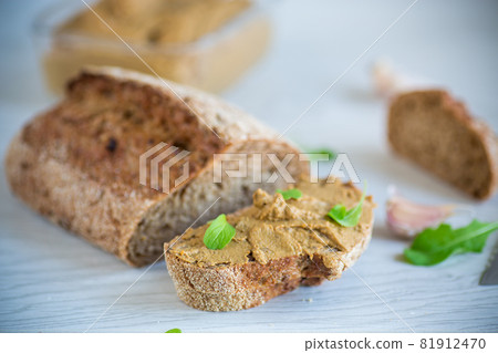 homemade liver pate with bread on a wooden table homemade liver pate with bread on a wooden table 81912470