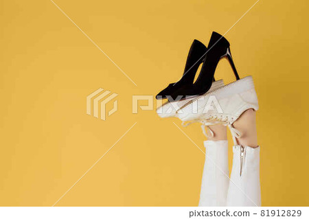 womens black shoes on inverted legs yellow background womens black shoes on inverted legs yellow background 81912829