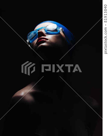 athletic woman in a swimming cap workout Studio 81913840