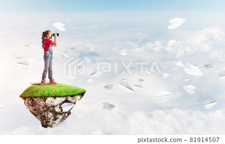 Concept of careless happy childhood with girl looking in binoculars Concept of careless happy childhood with girl looking in binoculars 81914507