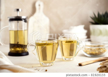 Herbal tea glass cups and teapot. Delicious healthy warm tea. Herbal tea glass cups and teapot. Delicious healthy warm tea. 81920133