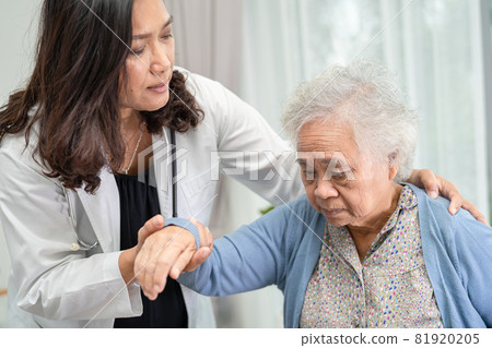 Help and care Asian senior or elderly old lady woman patient sitting on wheelchair at nursing hospital ward, healthy strong medical concept 81920205