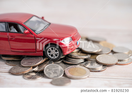 Car on coins background; Car loan, Finance, saving money, insurance and leasing time concepts. 81920230