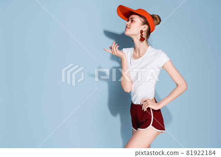 pretty woman in red cap decoration fashion blue background 81922184