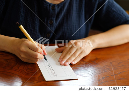 Japanese woman practicing penmanship, hard brush, brush pen Japanese woman practicing penmanship, hard brush, brush pen 81928457
