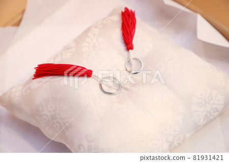 Two wedding rings, at their own ring pillow Two wedding rings, at their own ring pillow 81931421