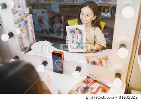 Kid shotting video with toys and having fun 81932322