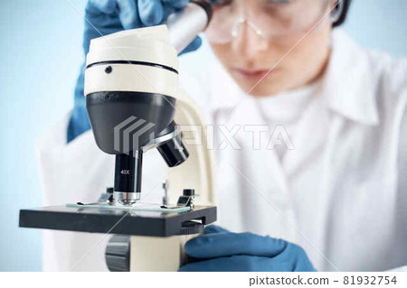 Woman in white coat laboratory microscope work science research Woman in white coat laboratory microscope work science research 81932754