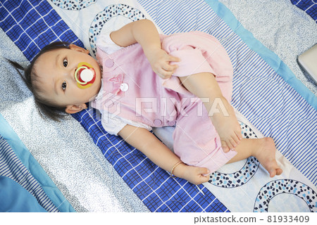 Charmiling Girl Sucking on Pacifier Charmiling Girl Sucking on Pacifier 81933409