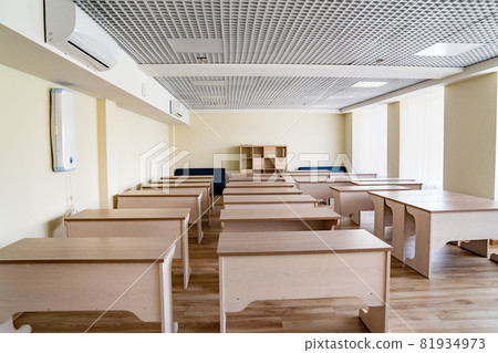 a classroom at the school. comfortable tables and chairs. a classroom at the school. comfortable tables and chairs. 81934973