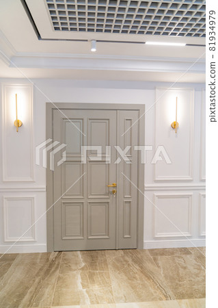large gray wooden door in white interior. classic large gray wooden door in white interior. classic 81934979