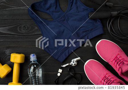 Workout plan with fitness food and equipment on dark background, top view 81935845