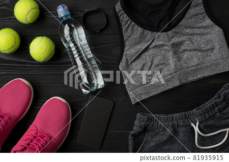 Sports accessories for fitness on the wooden floor. Healthy lifestyle concept. Sports accessories for fitness on the wooden floor. Healthy lifestyle concept. 81935915
