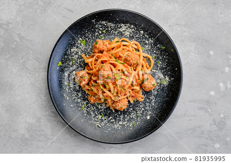 Top view of spaghetti pasta with meatballs and cheese 81935995