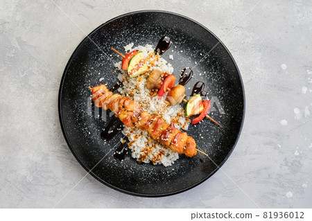Top view of shashlik with chicken and grilled champignon with bell pepper and zucchini Top view of shashlik with chicken and grilled champignon with bell pepper and zucchini 81936012
