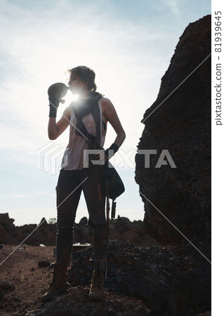 Hiker drinking water in the mountain Hiker drinking water in the mountain 81939645