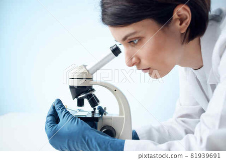 Woman in White Coat Looks Through Microscope Laboratory Science Professionals Experiment Woman in White Coat Looks Through Microscope Laboratory Science Professionals Experiment 81939691