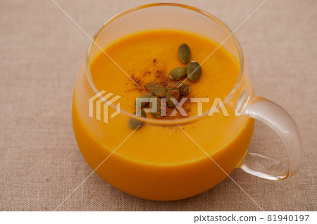 Rich pumpkin pudding decorated with cinnamon and pumpkin seeds Rich pumpkin pudding decorated with cinnamon and pumpkin seeds 81940197