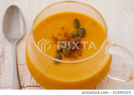 Rich pumpkin pudding decorated with cinnamon and pumpkin seeds 81940203