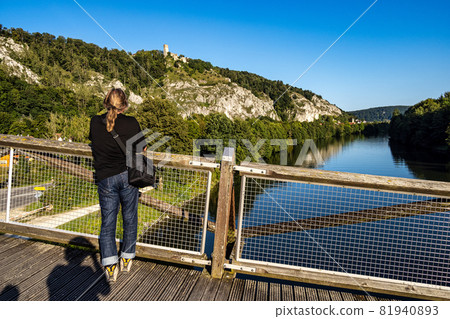 Wooden bridge Tatzelwurm in Essing at Altmuehl river below the ruins of Randeck Castle, Bavaria, Germany Wooden bridge Tatzelwurm in Essing at Altmuehl river below the ruins of Randeck Castle, Bavaria, Germany 81940893