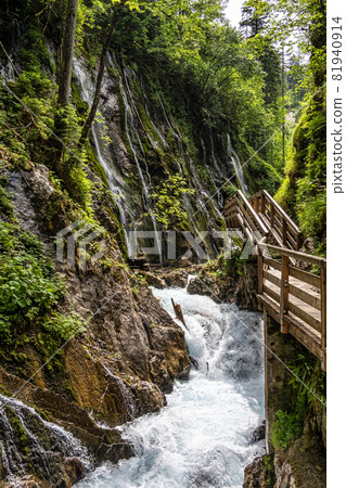 Beautiful Wimbachklamm gorge with wooden path at Ramsau bei Berchtesgaden in Germany Beautiful Wimbachklamm gorge with wooden path at Ramsau bei Berchtesgaden in Germany 81940914