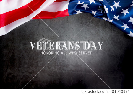 Veterans day. Honoring all who served. American flag on gray background with copy space. 81940955