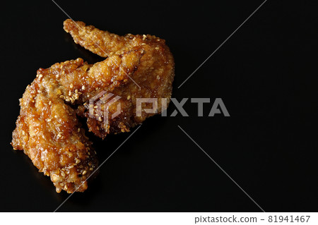 Shooting sweet and spicy chicken wings on a black background 81941467