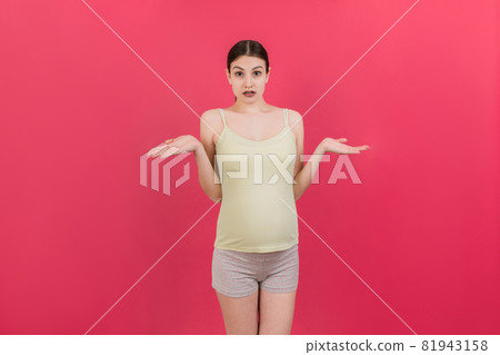 happy surprised pregnant woman posing isolated over colored background. copy space happy surprised pregnant woman posing isolated over colored background. copy space 81943158