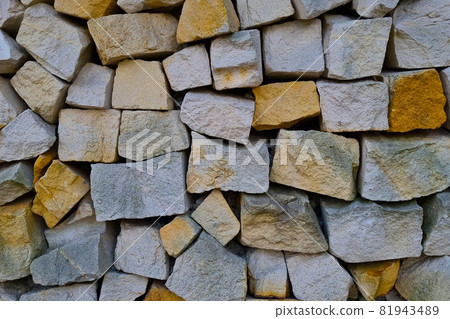 The texture of the stone path or the wall of the building, the background. The texture of the stone path or the wall of the building, the background. 81943489