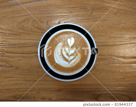 Cup of cappuccino on a wooden table Cup of cappuccino on a wooden table 81944337
