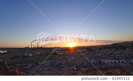 An epic sunset with a view of the smoke of factory An epic sunset with a view of the smoke of factory 81945522