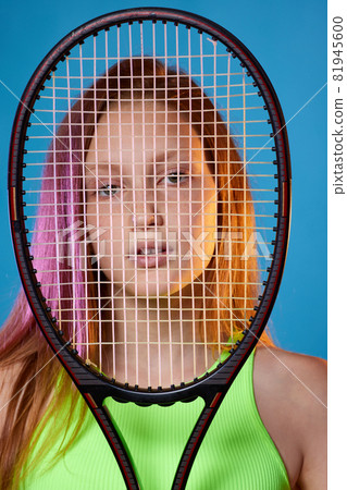 girl teenager with racket in sporswear and hat girl teenager with racket in sporswear and hat 81945600