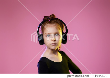 child girl in sunglasses and headphones listening to music child girl in sunglasses and headphones listening to music 81945629