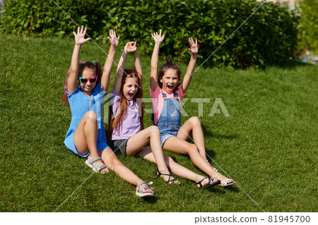 cute children girls playing together in the park cute children girls playing together in the park 81945700