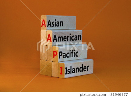 AAPI symbol. Abbreviation AAPI asian american pacific islander on wooden blocks. Beautiful orange background. Copy space. Business and AAPI asian american pacific islander concept. 81946577