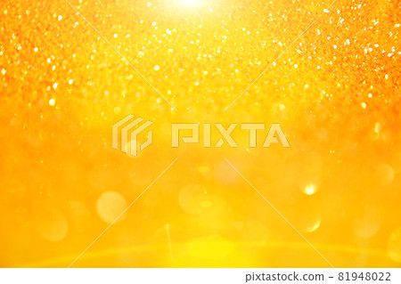 The blurred texture of the golden shine. Background with gold glitter or yellow sequins. Seamless texture with yellow gold sequins. Flickering background. High quality photo 81948022