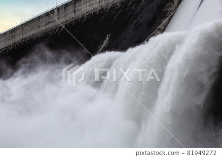Water flowing over floodgates of a dam at Khun Dan Prakan Chon, Nakhon Nayok Province, Thailand Water flowing over floodgates of a dam at Khun Dan Prakan Chon, Nakhon Nayok Province, Thailand 81949272