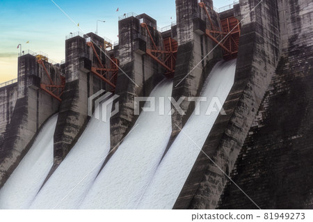 Water flowing over floodgates of a dam at Khun Dan Prakan Chon, Nakhon Nayok Province, Thailand Water flowing over floodgates of a dam at Khun Dan Prakan Chon, Nakhon Nayok Province, Thailand 81949273