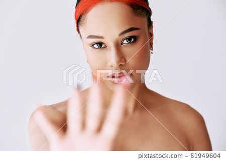 Pretty african american woman outstretched hand and showing stop hand sign 81949604