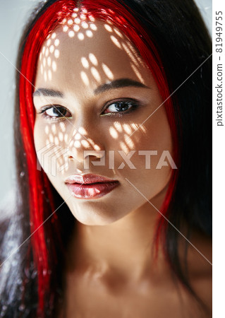 Portrait of pretty african american woman with shadows on her face Portrait of pretty african american woman with shadows on her face 81949755