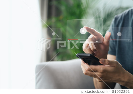 Man using smartphone for watching video on internet, online streaming, online class, content creator 81952291