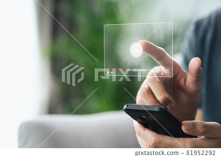 Man using smartphone for watching video on internet, online streaming, online class, content creator 81952292